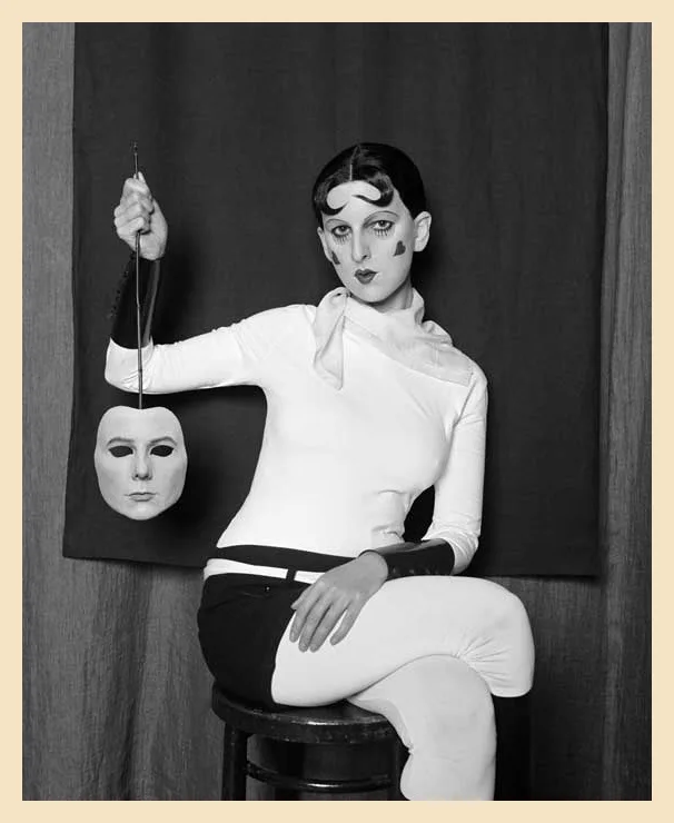 A girl sitting in a room holding a head